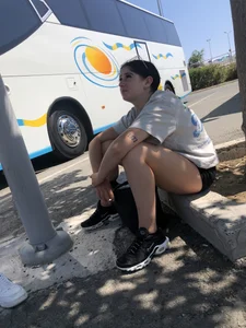 Girls with hot legs waiting at the bus stop