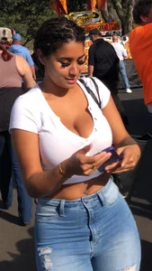 Huge tits in a low cut white top and tight jeans