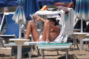 Girls on a nude beach in Bibione, Italy