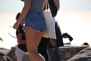 Sexy tourist in short jean shorts showing cheeks