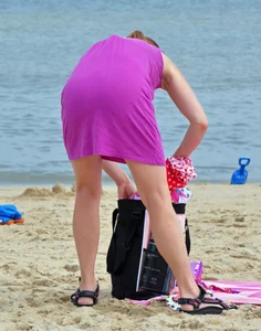 Blue bikini beach girl undressing with a decent ass
