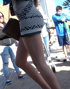 Sexy babe in a tiny skirt showing her ass and panties