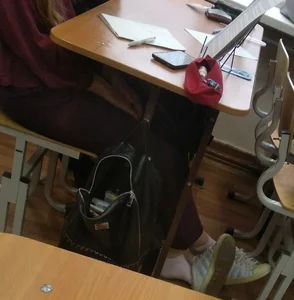 Young Student Girl’s Feet in Socks With Sneakers Half Taken Off Candid Pics