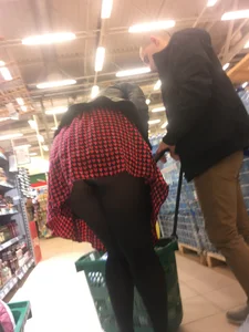 Girl in Checkered Skirt and Black Pantyhose Bending Over in the Supermarket Candid