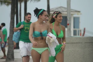 Saint Patrick's Day girls in bikinis at Deerfield Beach in Florida