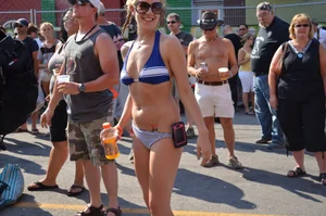Hot ass Canadian babe in a bikini dancing at a concert