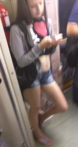 Teen in a Top, Mini-Shorts and Sandals in a Subway Train Candid
