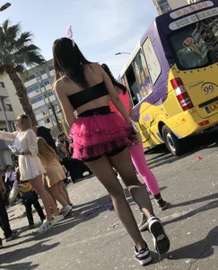 Hot carnival girl in in a top, mini shorts with pink frill and awesome legs in fishnet pantyhose