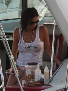 Bikini babe on a boat with a wet see through white shirt showing her tits