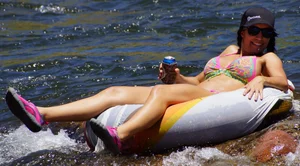 Sexy party girls in bikinis on a lake