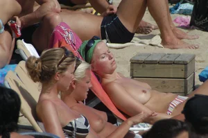 Topless girls on a beach in Barcelona