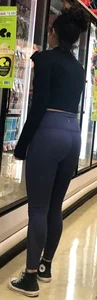 Girl with glasses shopping in leggings showing her VPL
