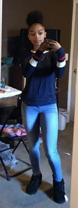 Girl in tight jeans mirror selfie at home