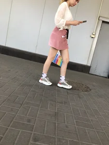 Cute street candid girl in a skirt