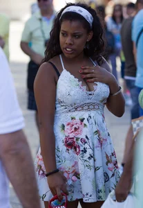 Black girl showing major cleavage in dress and almost upskirted