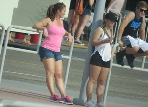 Couple of babes standing around in shorts