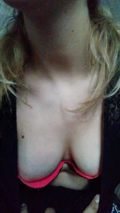 Closeup of a blonde's boobs downblouse