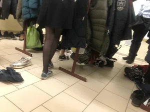 College Teen in the Cloakroom - Skirt And Skinny Legs in Black Pantyhose Closeup