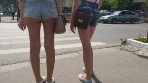 Two Hot Candid Girls With Long Slim Legs in Denim Shorts Standing on the Crosswalk - City Street Creepshot