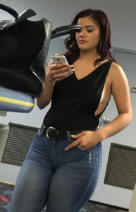 Thick brunette in tight jeans and showing some side boob