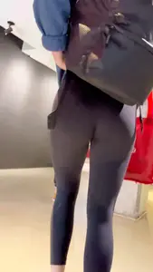 College girl going up the stairs with leggings and pink crocs