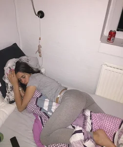Barefoot Girl in Grey Pants Asleep in Bed Candid Photo