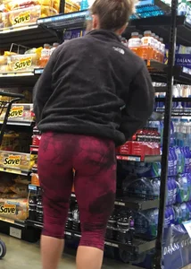 Milf grocery shopping in red leggings with a great ass