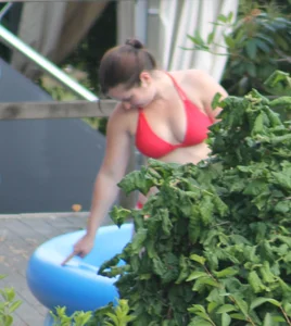 Thick babe in the backyard in red bikini