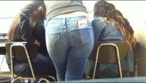 Juicy Booty in Tight Blue Jeans With a Smartphone Stuffed into the Back Pocket