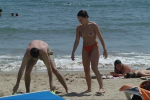 Girls on a nude beach in Sitges, Spain