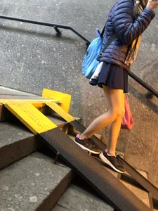 Girl With Skinny Legs in Pahtyhose and a Skirt Walking Down the Stairs Street Candid Gallery
