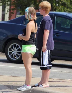 Blonde girl in glasses with a thick booty in green shorts