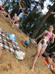 Girls in One-Piece Body Swimsuits Running Towards Water and Swimming - Beach Photo Gallery