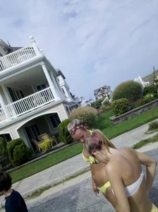 Two sexy babes in yellow bikinis at an ice cream truck