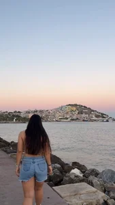 Girl in shorts, very long hair outdoors creepshot