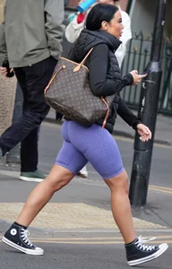 Wide hipped, juicy fronted tanned brunette pawg struts in lycra shorts