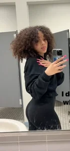 Cute girl with curly hair sexy mirror selfies