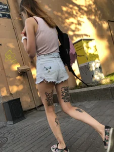 Skinny Girl in Denim Shorts With Fit Tattooed Legs Street Creepshots Gallery