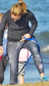Beach redhead milf in patterened leggings at the beach