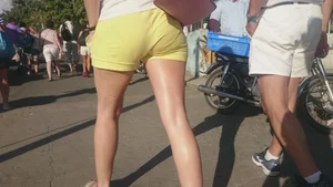Milf in yellow shorts with vpl and a wedgie