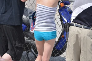 Skinny babe with a cute little ass in tiny blue shorts