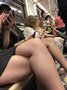 Hot Girls in a Subway Train Sitting With Crossed Legs Closeups And Flashing Booties Under Skirt