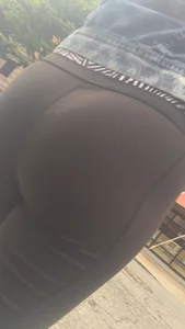 Girl with a nice ass in leggings walking down the street
