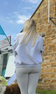 Pretty blonde in white leggings at the beach