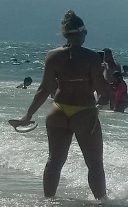 Big booty white chick in a yellow thong at the beach