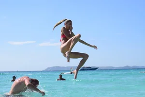 Skinny Girl in Swimsuit Jumping into Water