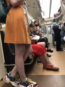 Cute Teen Girl in a Dress With Slim Legs Standing in the Subway Train, Then Crossing the Street Photo Gallery