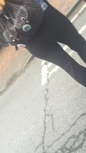 Girl with a nice ass in leggings walking down the street