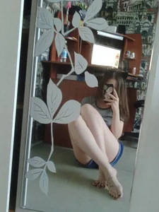 Girl with Hot Legs and Bare Feet Sitting on the Floor Mirror Selfie