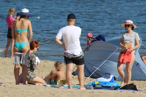 Couple of hot babes hanging out at the beach in bikinis
